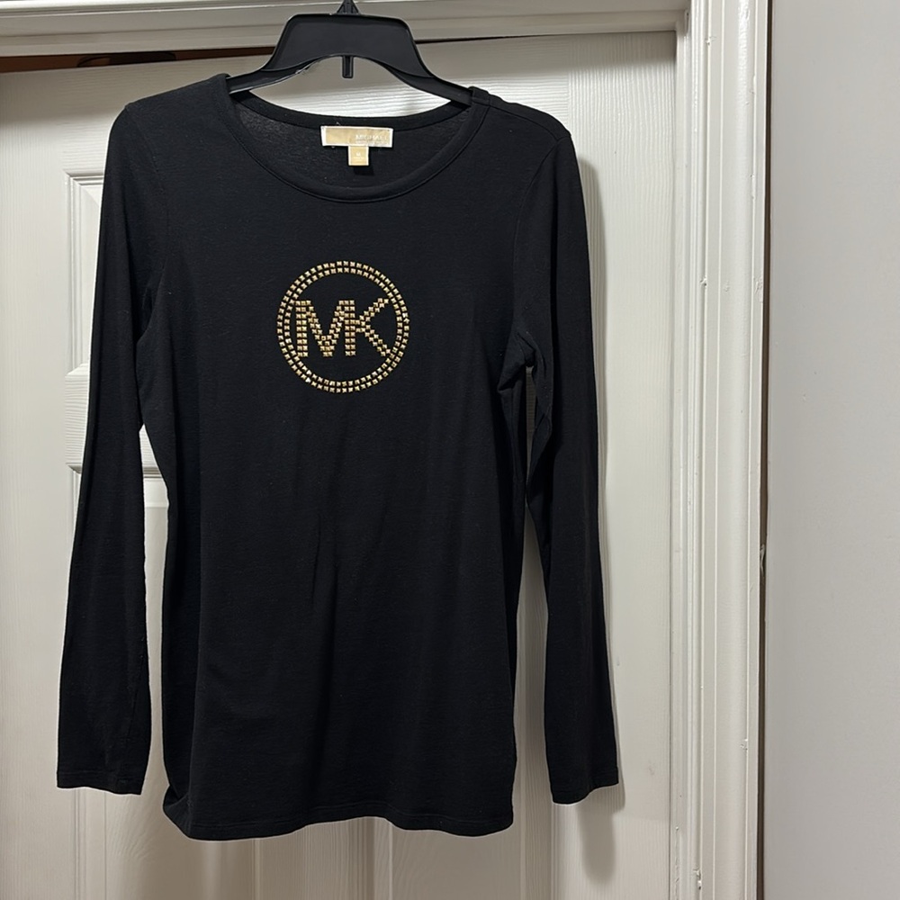 Michael Kors signature MK logo in gold metal studs.